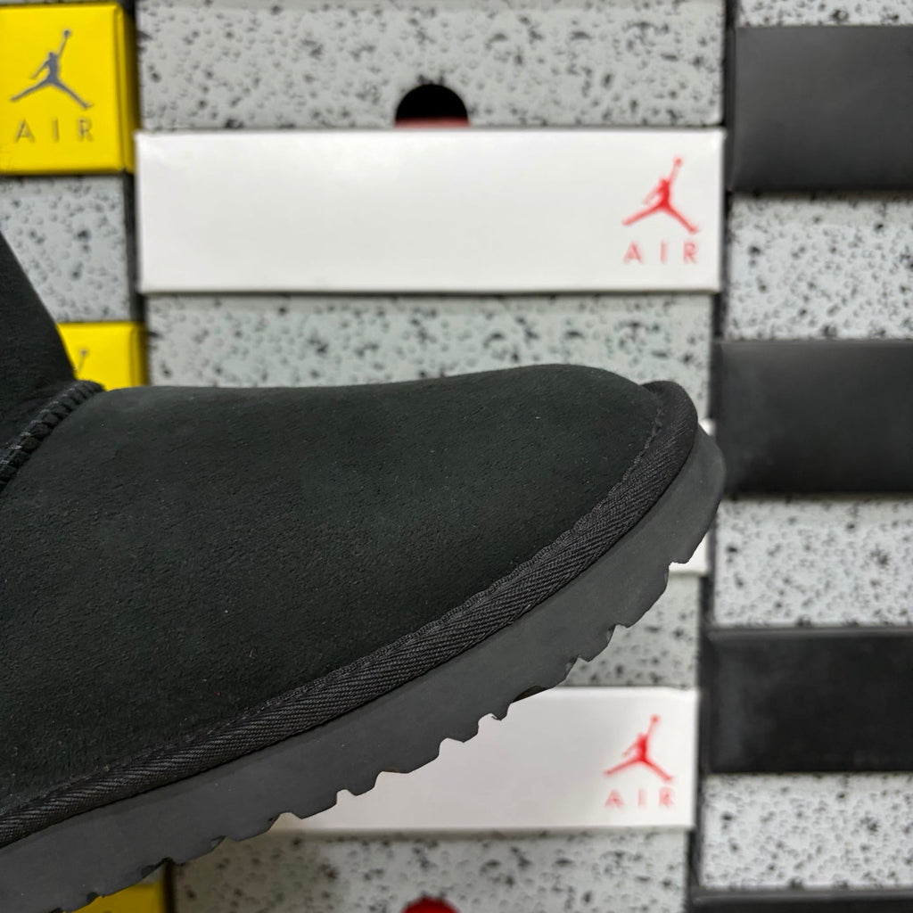 UGG Mini Bailey Bow Ankle Boot – Suede Boot with Tonal Black Shearling Lining, Black Satin Bow & All-Black Lug Sole in Black