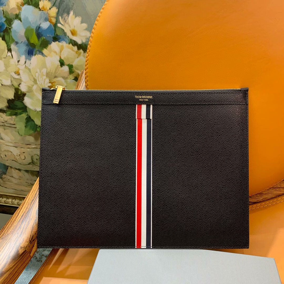 Three-color woven clutch bag