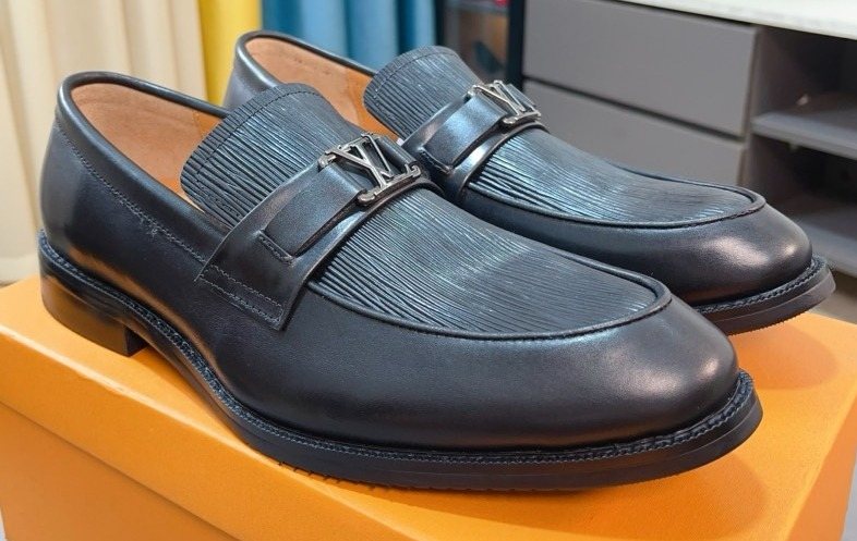 Louis Vuitton Men's Black Textured Buckle Loafers - Rounded Toe And Dark Sole